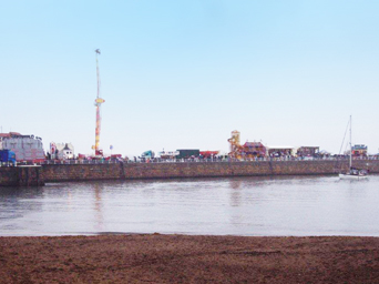 The
              Fairground rides on the West Pier on Regatta Monday Photo