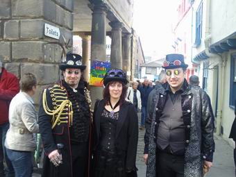 Photo of three Whitby Goths in the Market Square