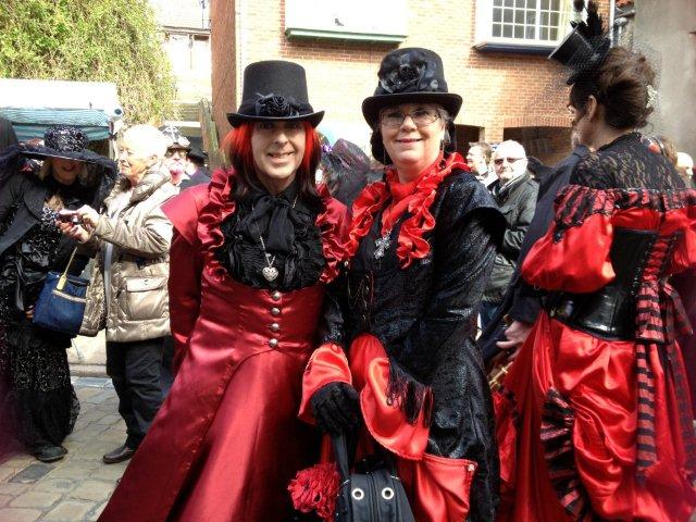 Photo of two Gothic ladies in red and black